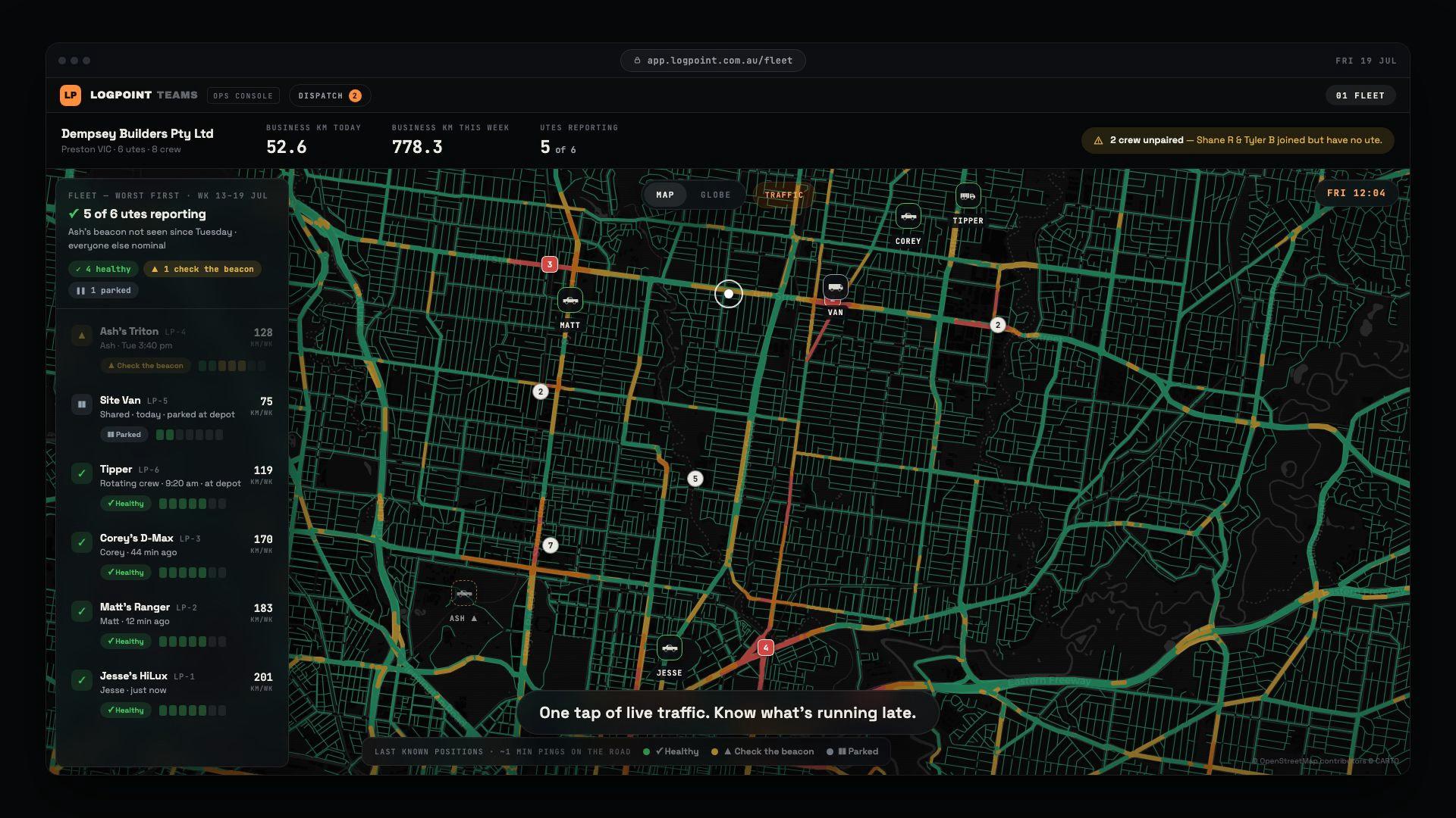 The same fleet map with the TRAFFIC toggle on: main roads drawn in green, amber and red flow lines over the dark basemap, six vehicle pins, and the caption One tap of live traffic, know what’s running late.